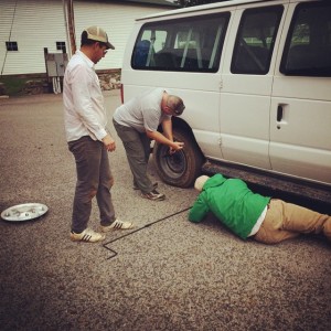 Field Assistant Joey Keasler changes the flat tire on the field school van (with help from the students). Thanks guys!