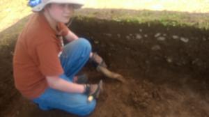 Will S., aspiring archaeologist, learning how to trowel.